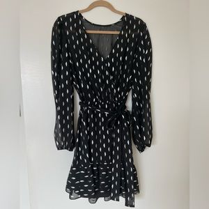 Black dress with metallic silver crescent shape detail size 10